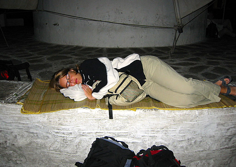 Sleeping outside while waiting for late ferries in the port of Parikia.