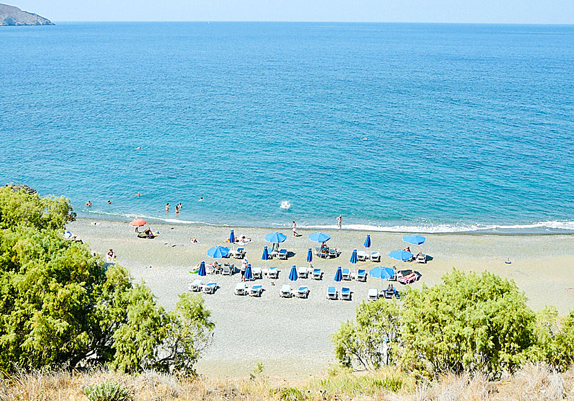 Sunbeds and umbrellas on the beach of Platys Gialos on Kalymnos.
