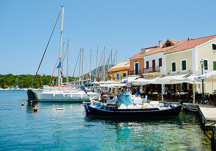Sailing boats, tavernas and restaurants in Fiskardo on Kefalonia in Greece. 