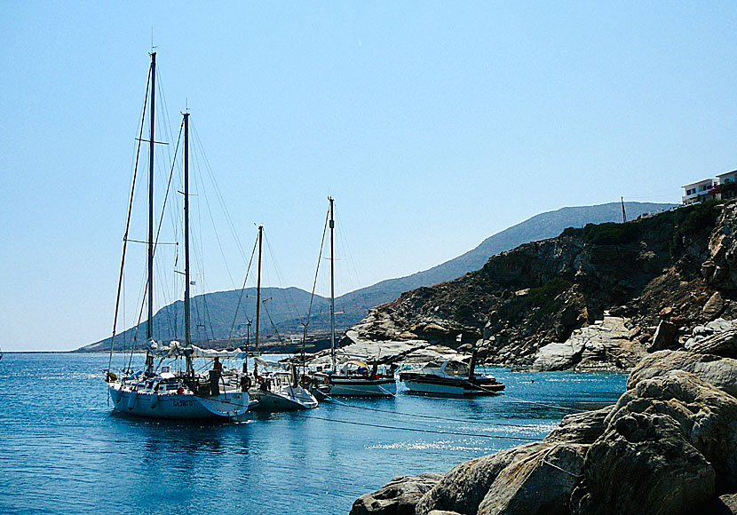 Rock baths and sailing boats below The Rock Café and The Rock Rooms in Alopronia on Sikinos.