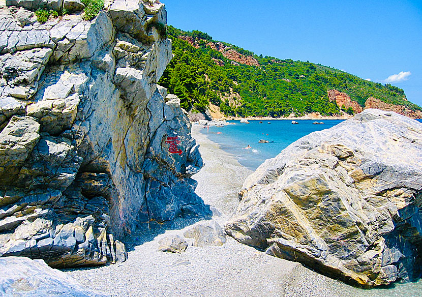 Two rocks separate the naturist beach of Velanio from the snorkel-friendly part of the beach.