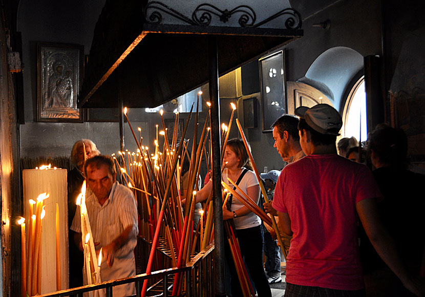The longest candles do not fit in the church and are lit and placed to the right of the entrance.