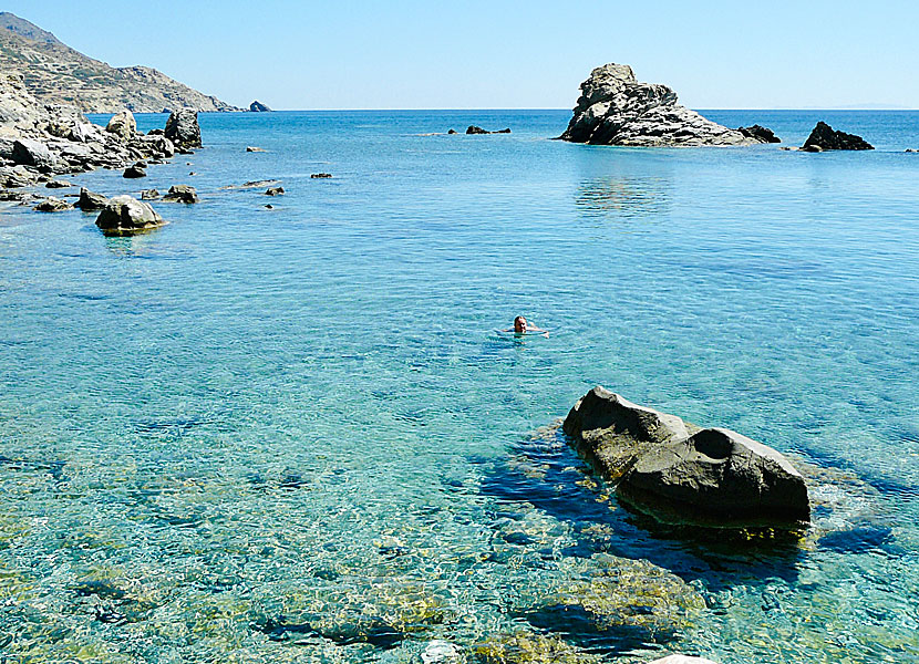 Amoudi beach on Amorgos is surrounded by crystal clear turquoise water.