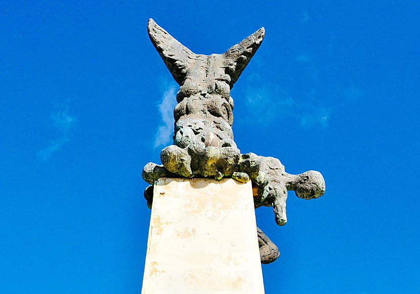 A statue standing by the monument. The Holocaust of Ano Viannos and Amiras in Crete.