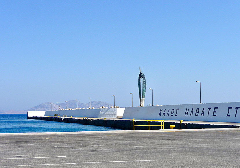 The statue of Icarus who flew too close to the sun on the harbour pier of Agios Kirikos in Greece.