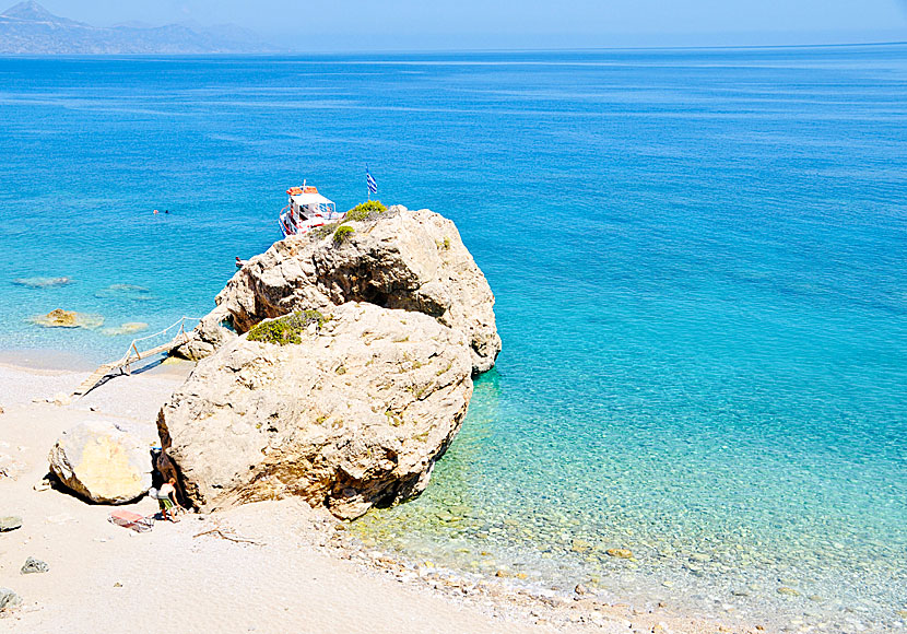 Cliff bath and pebble beach at Kato Lakos beach on Karpathos.