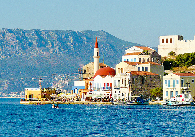 The mosque, the minaret and the lighthouse Faros in Megisti on Kastellorizo in Greece.