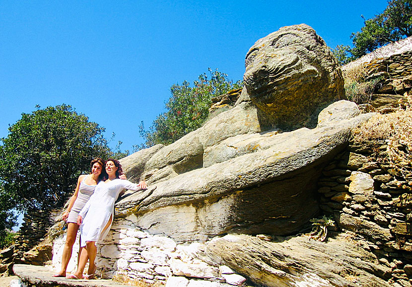 The smiling lion of Kea grins at two smiling women from Greece.