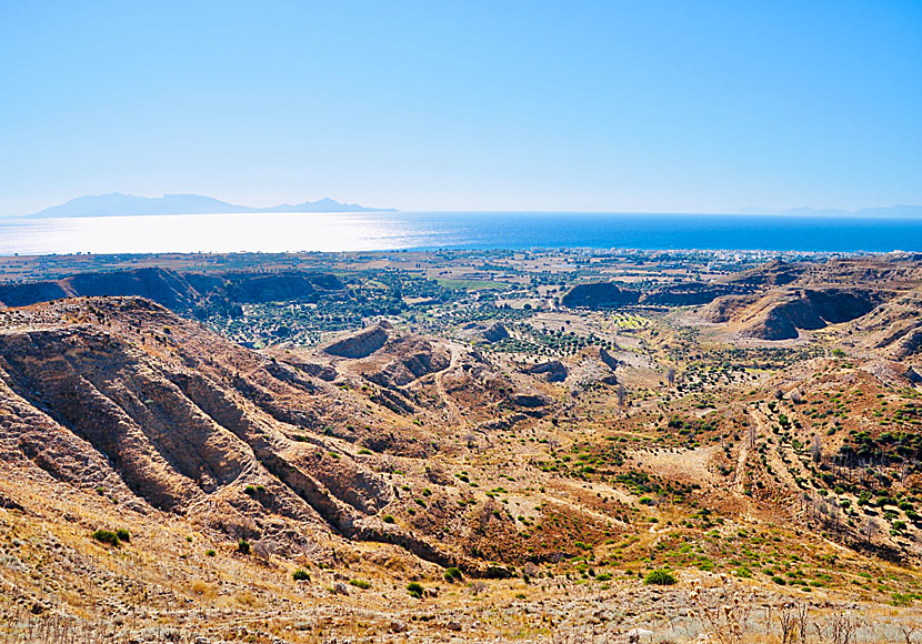 The landscape outside Antimachia Castle looks like the moon with the neighboring island of Nisyros in the background.