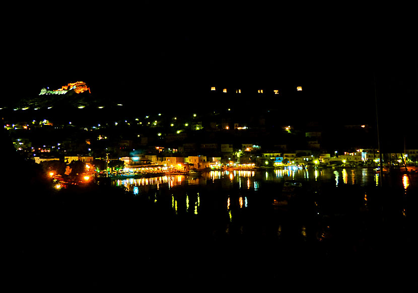 Panteli in the evening with the illuminated castle and the illuminated windmills.