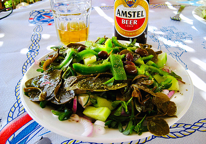 Greek salad with capers and caper leaves at Dilaila Restaurant on the island of Lipsi in Greece.