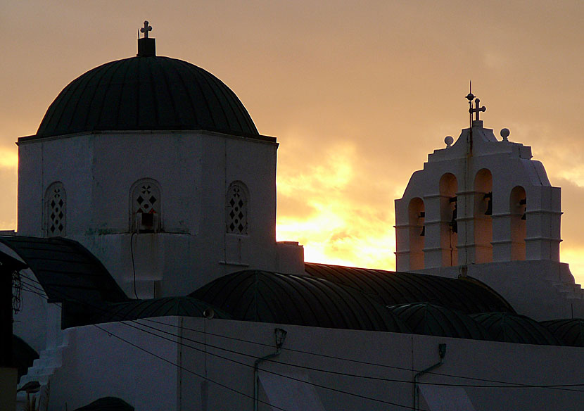 The sun sets behind the cathedral in Naxos town.