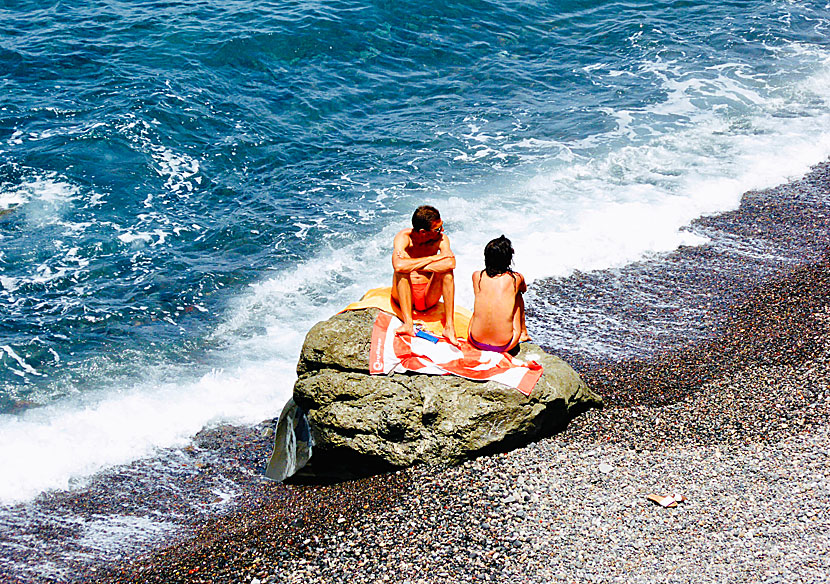 Lava stones and lava rocks on the beaches of Santorini.