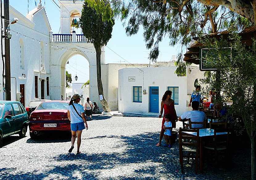 Tavernas and restaurants in the square near the Megalochori clock tower.