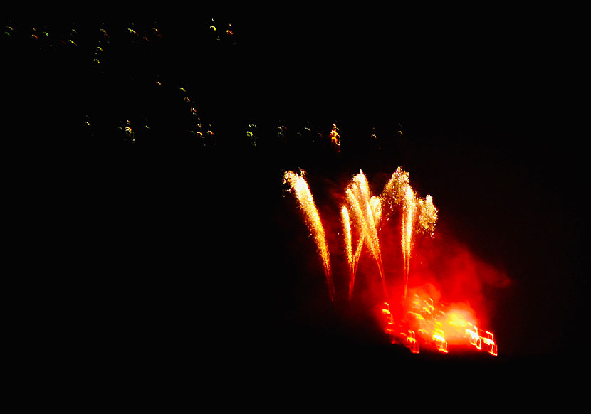 Pyrotechnic lava flows down the volcano Nea Kameni during the day of the volcano.