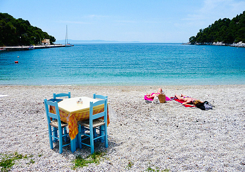 Sunbeds and parasols on Agnontas beach.