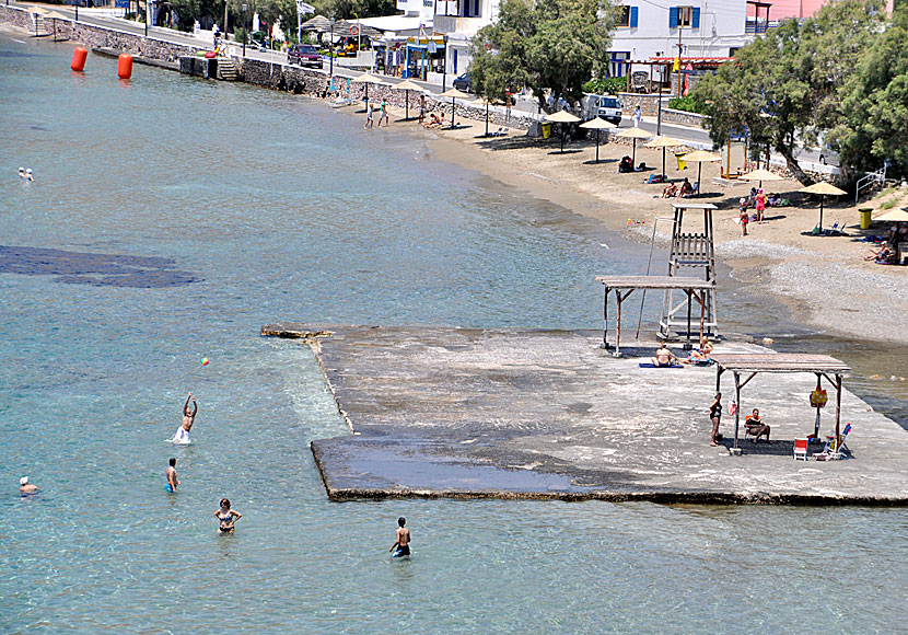 The cement foundation with sunbeds at Finikas beach on Syros.