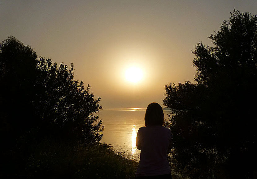 The sunrise seen from the hill down to the port of Livadia on Tilos in Greece.