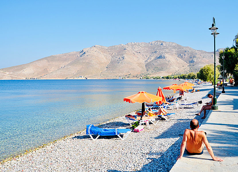 The pebble beach and the seafront promenade in Livadia in Tilos.