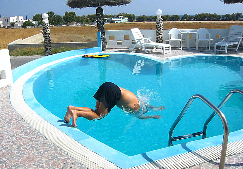 The boy in the bubble with Paul Simon in a swimming pool at Honeymoon Beach Hotel in Perivolos on Santorini