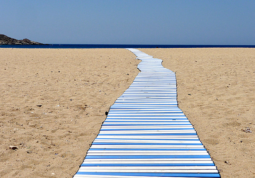 Road to nowhere with Talking Heads at an empty road to Mylopotas beach on Ios in Greece.